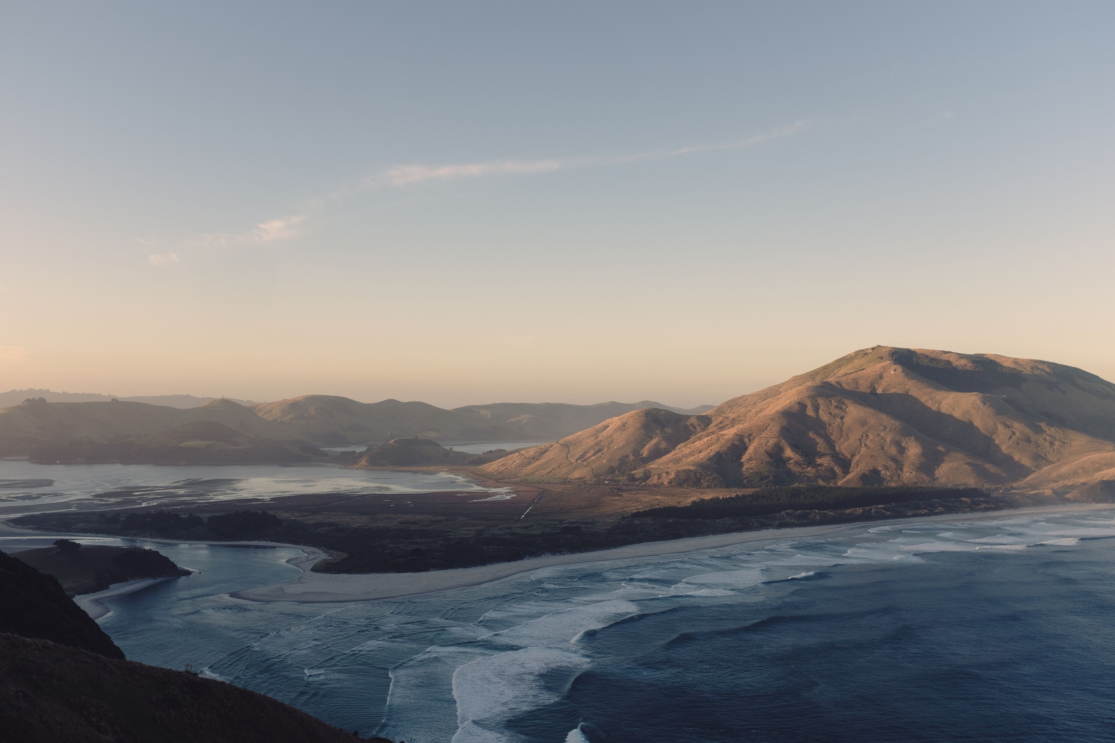 Overlooking Allans Beach at dusk from a high vantage point.